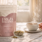 Freja Balance tea package with a steaming cup of tea on a table.
